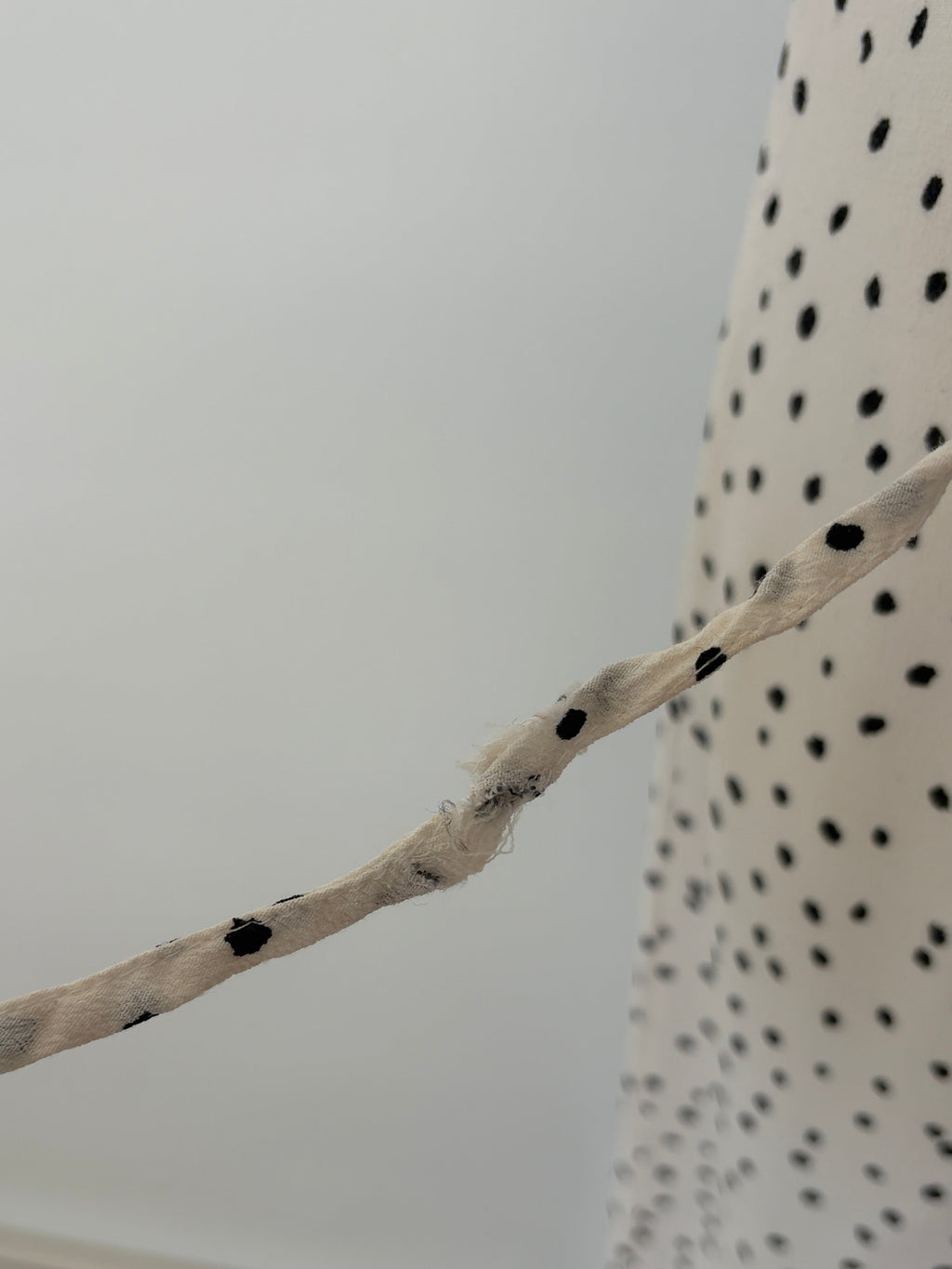 Alice in the Eve Polka Dot Wrap Midi Dress in cream & black – view 3 of 5