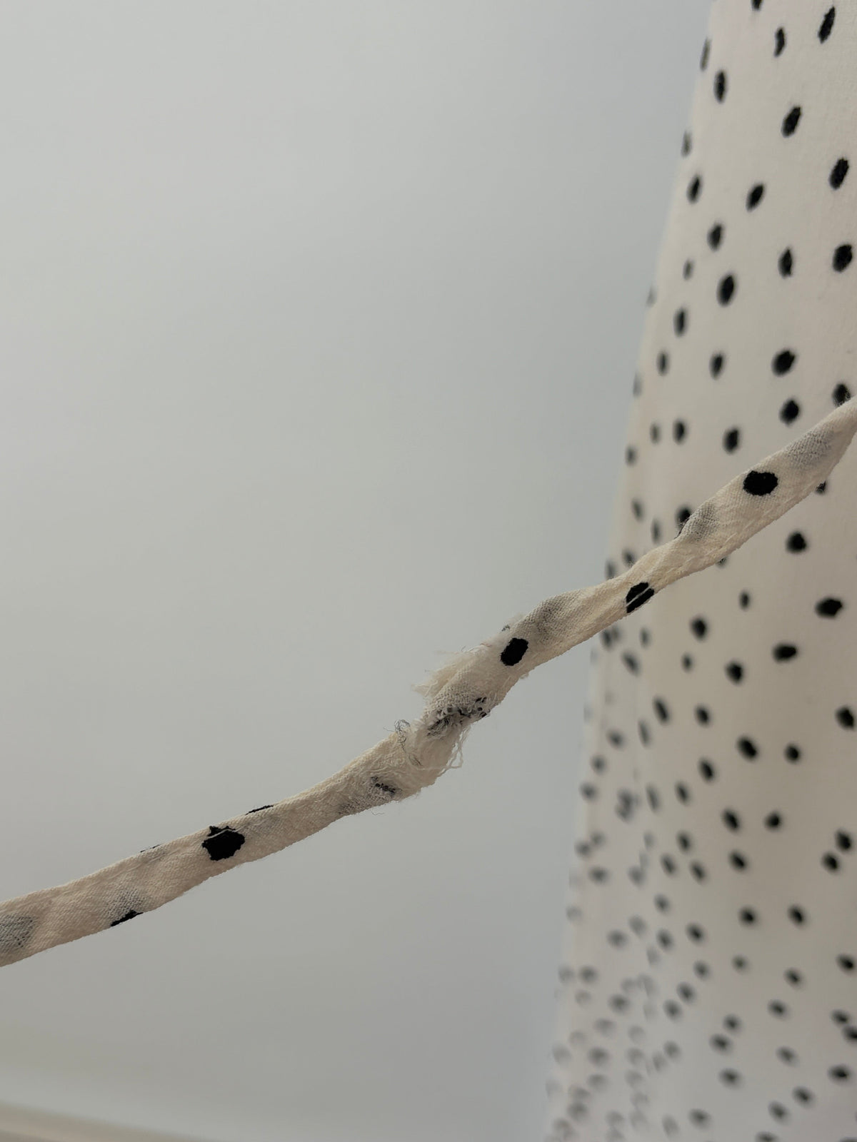 Alice in the Eve Polka Dot Wrap Midi Dress in cream & black – view 3 of 5